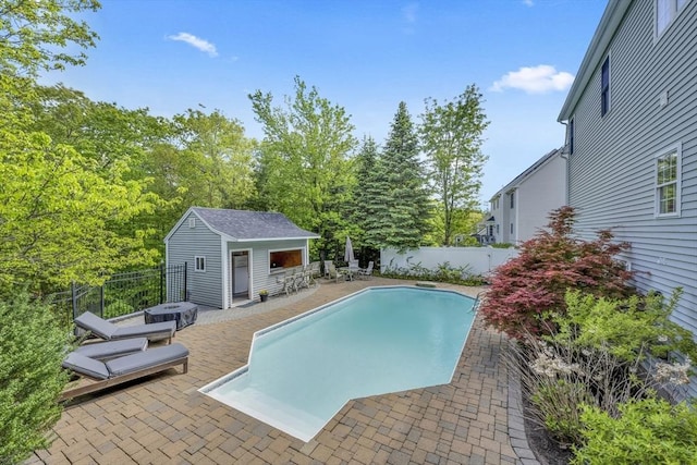 18 Preserve Way, Sturbridge, MA 01566 - view of pool featuring a fenced backyard, a patio area, an outbuilding, and a storage structure