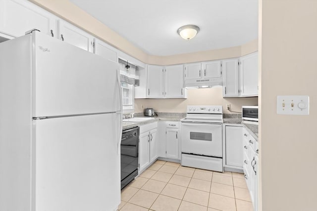 kitchen featuring white appliances, under cabinet range hood, light tile patterned flooring, light countertops, and white cabinets