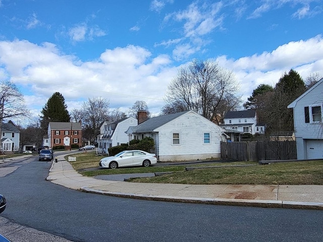 24 Neillian Cres, Boston, MA 02130 - view of asphalt road with sidewalks, a residential view, and curbs