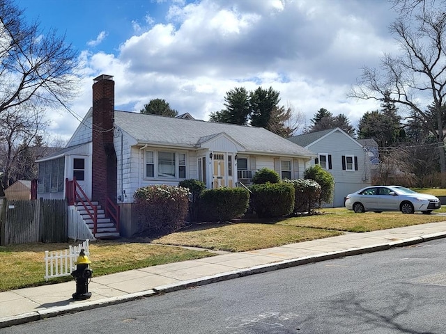 24 Neillian Cres, Boston, MA 02130 - view of front of house featuring a chimney and a shingled roof