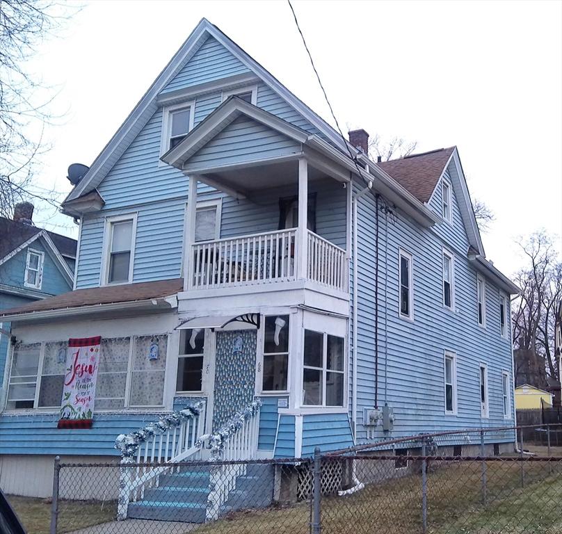 view of front of home with a balcony