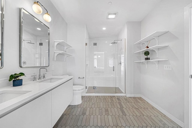 191 Washington St Unit 318, Boston, MA 02135 - full bathroom featuring a stall shower, toilet, double vanity, recessed lighting, and tile patterned flooring