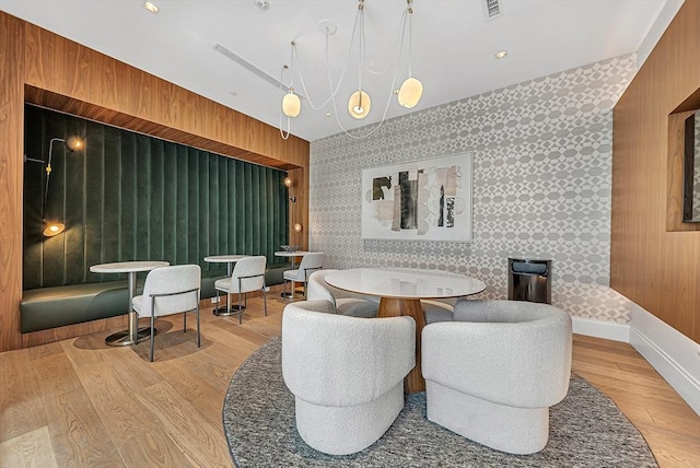 191 Washington St Unit 318, Boston, MA 02135 - dining area with wood finished floors, wallpapered walls, and baseboards