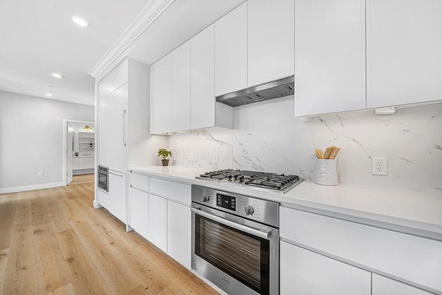 191 Washington St Unit 318, Boston, MA 02135 - kitchen featuring appliances with stainless steel finishes, light countertops, under cabinet range hood, decorative backsplash, and recessed lighting