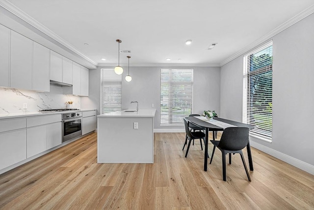 191 Washington St Unit 318, Boston, MA 02135 - kitchen featuring stainless steel appliances, light countertops, white cabinetry, baseboards, and crown molding