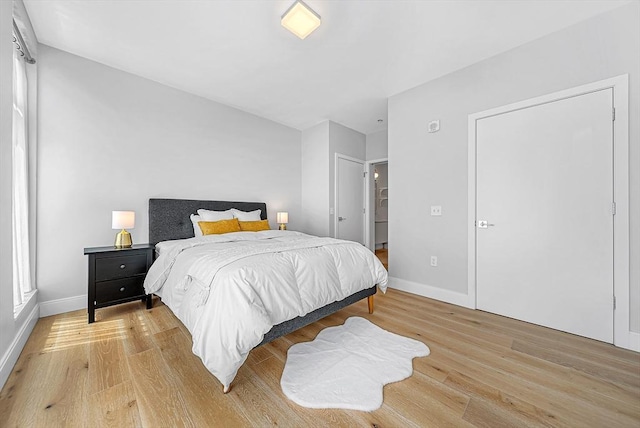 191 Washington St Unit 318, Boston, MA 02135 - bedroom featuring light wood-type flooring and baseboards