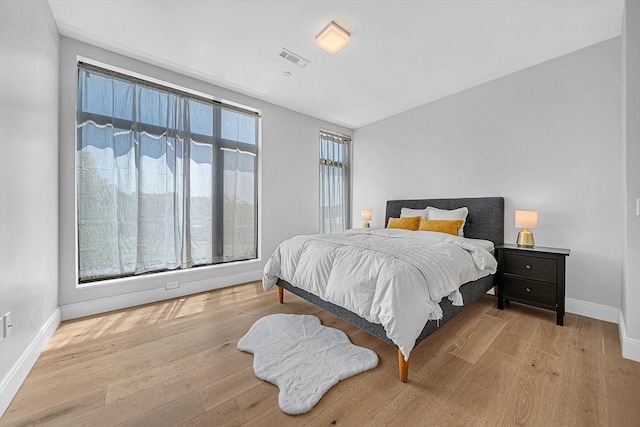 191 Washington St Unit 318, Boston, MA 02135 - bedroom with baseboards and wood finished floors