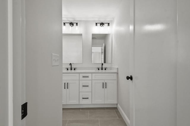 bathroom with tile patterned floors and vanity