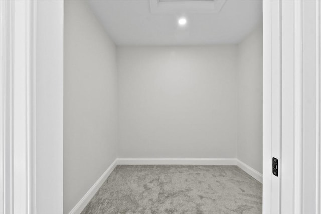 unfurnished room with light carpet