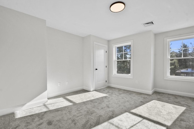 spare room with light colored carpet