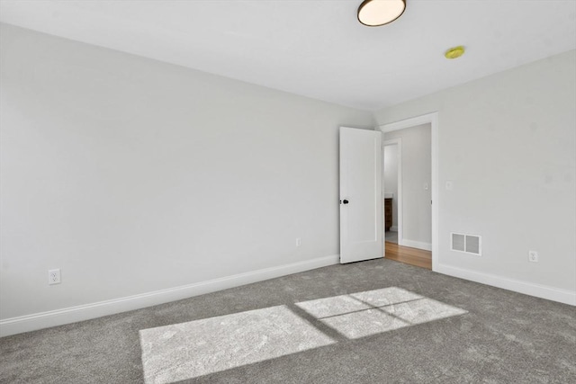 empty room featuring carpet floors