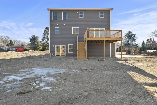 back of house featuring a deck