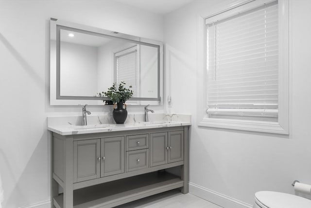 bathroom with vanity and toilet