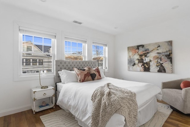 bedroom featuring dark hardwood / wood-style flooring