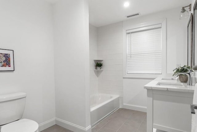 full bathroom with shower / bathing tub combination, tile patterned flooring, vanity, and toilet