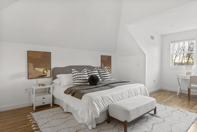 bedroom with wood-type flooring