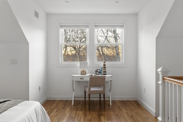 bedroom with hardwood / wood-style floors