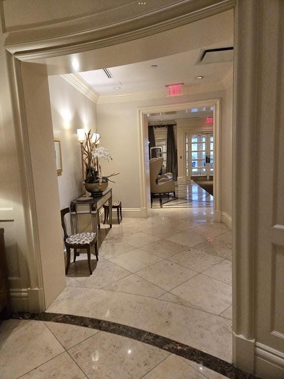 hallway with crown molding, french doors, and baseboards