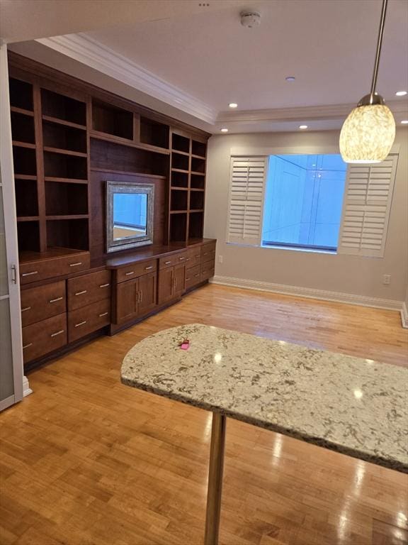 unfurnished living room featuring ornamental molding, baseboards, recessed lighting, and light wood-style floors