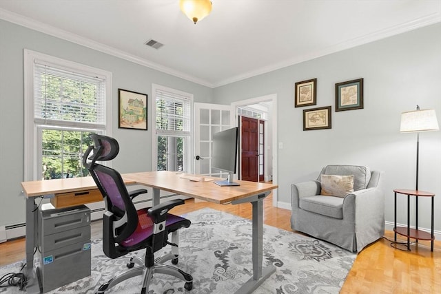 office area with ornamental molding and light hardwood / wood-style floors