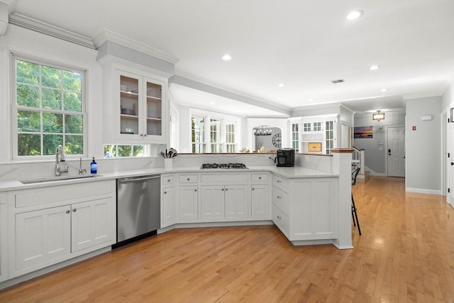 kitchen featuring sink, ornamental molding, white cabinets, and dishwasher