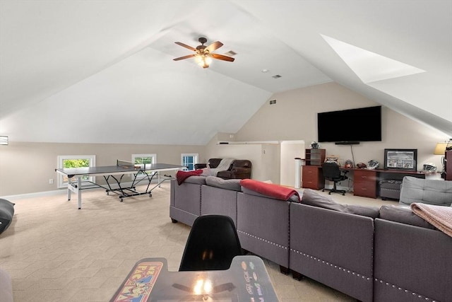 living room with ceiling fan and vaulted ceiling