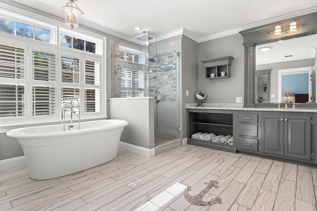 bathroom featuring vanity, ornamental molding, and plus walk in shower