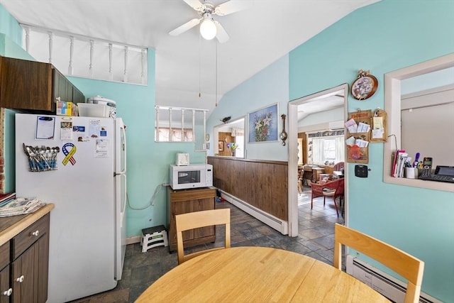 kitchen with a baseboard heating unit, white appliances, a ceiling fan, and dark brown cabinetry