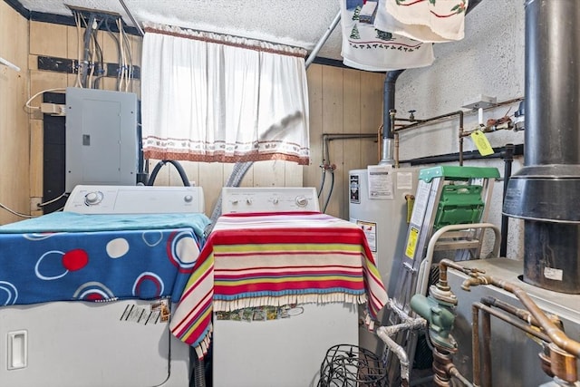 interior space featuring washing machine and dryer, gas water heater, and electric panel