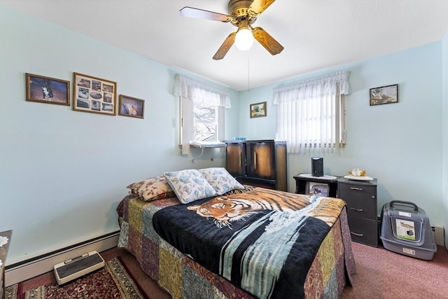 carpeted bedroom featuring multiple windows, baseboard heating, and a ceiling fan