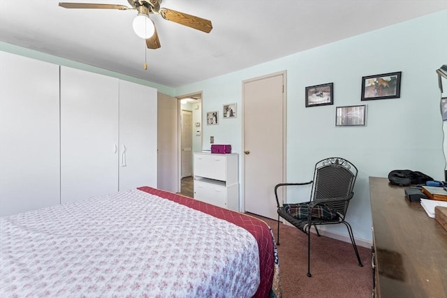 carpeted bedroom featuring ceiling fan and ensuite bathroom