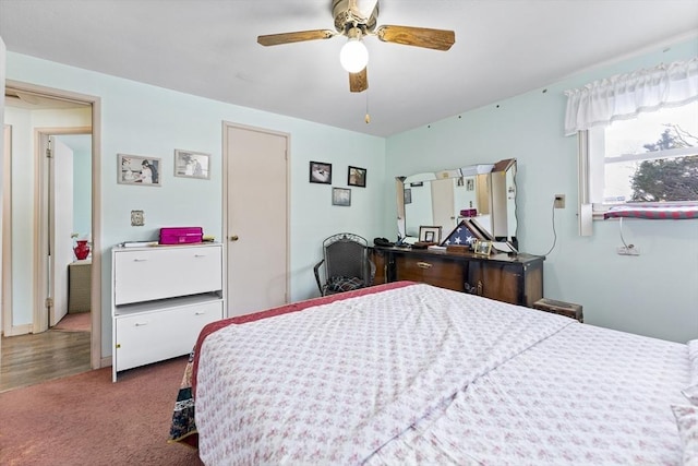 carpeted bedroom with a ceiling fan