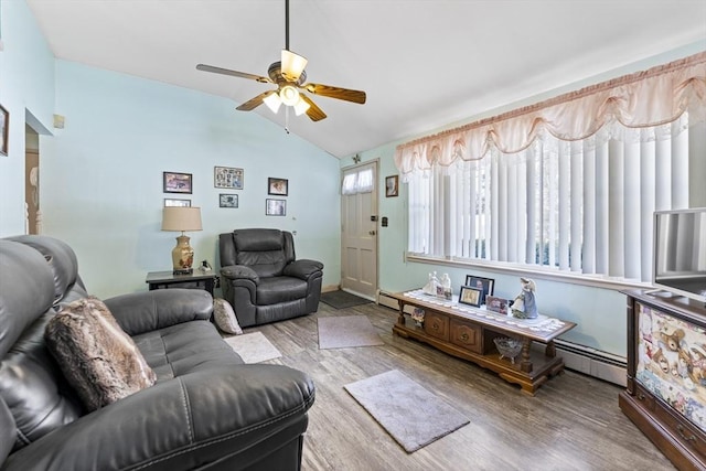 living room featuring lofted ceiling, ceiling fan, a baseboard heating unit, and wood finished floors