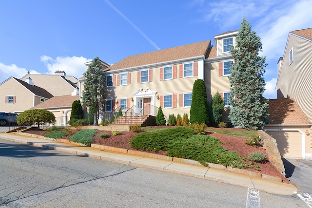 colonial-style house featuring a garage