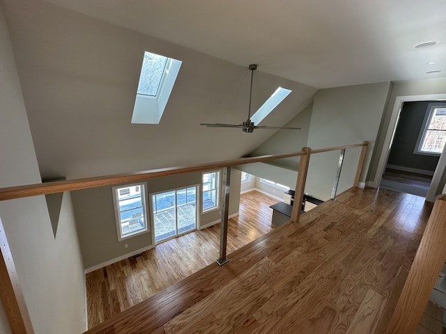 bonus room with ceiling fan, light hardwood / wood-style floors, and lofted ceiling