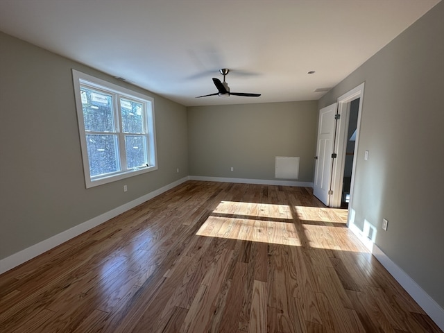 unfurnished bedroom featuring hardwood / wood-style floors and ceiling fan