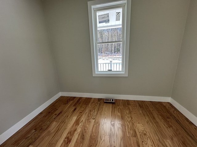 spare room featuring light hardwood / wood-style floors