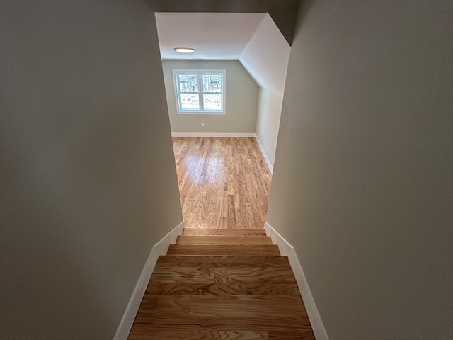 interior space with hardwood / wood-style floors and lofted ceiling