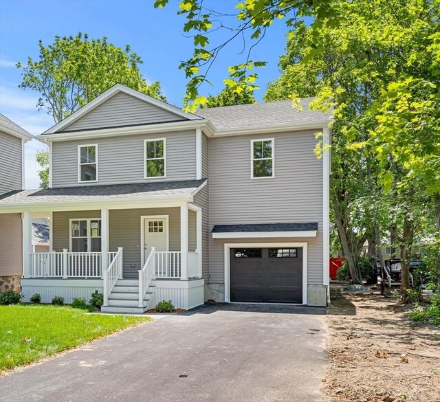 13 River Unit 2, Danvers, MA 01923 - view of front of property featuring asphalt driveway, covered porch, and a garage