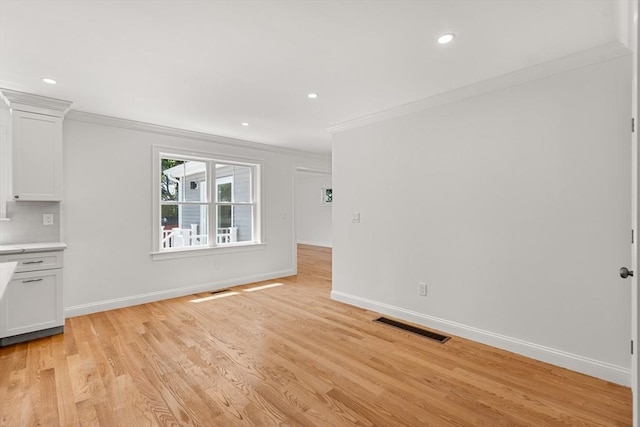 13 River Unit 2, Danvers, MA 01923 - unfurnished living room featuring ornamental molding, light wood-type flooring, and recessed lighting