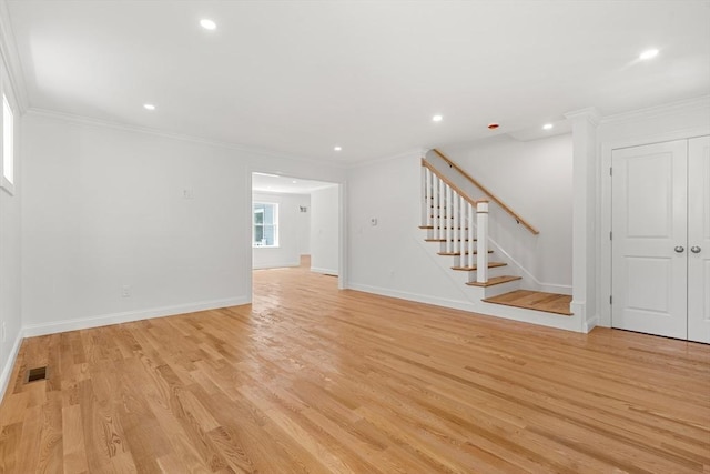 13 River Unit 2, Danvers, MA 01923 - unfurnished living room featuring stairs, crown molding, light wood-style flooring, and recessed lighting