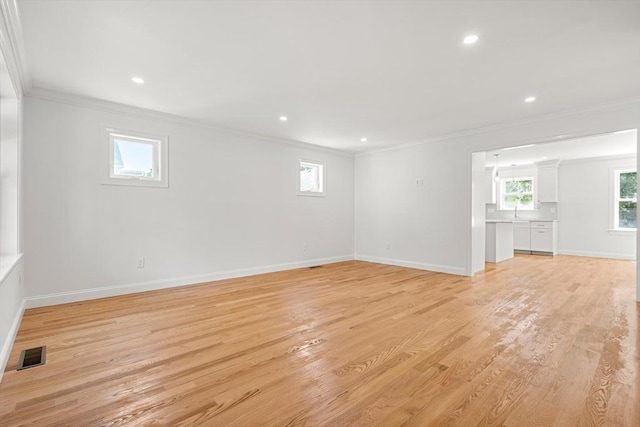 13 River Unit 2, Danvers, MA 01923 - empty room featuring ornamental molding, light wood-style flooring, and recessed lighting
