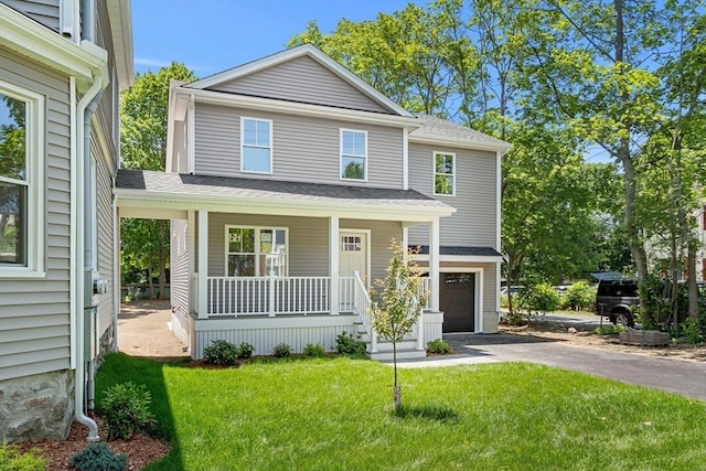 13 River Unit 2, Danvers, MA 01923 - view of front of house with covered porch, asphalt driveway, a front yard, a garage, and a shingled roof