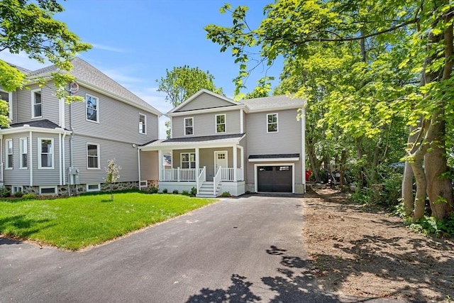 13 River Unit 2, Danvers, MA 01923 - view of front facade with covered porch, driveway, a garage, and a front yard