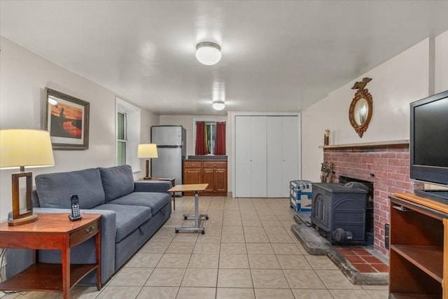 639 Washington St, Walpole, MA 02032 - living room with a wood stove and light tile patterned floors