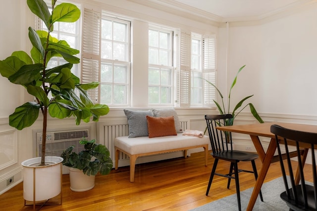 sitting room featuring crown molding and hardwood / wood-style flooring