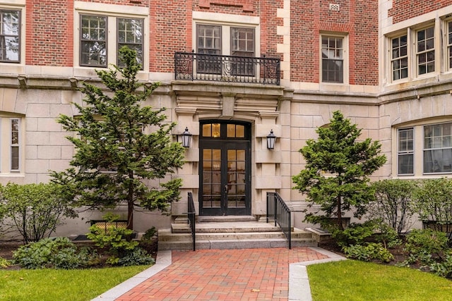 property entrance with french doors and a balcony