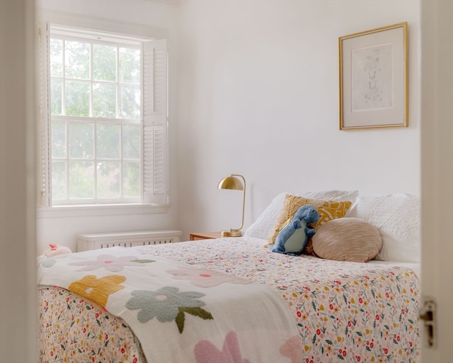 bedroom with radiator heating unit