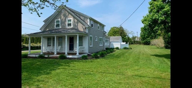 exterior space with a porch and a yard