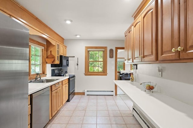 10 Powderhouse Cir, Wilmington, MA 01887 - kitchen featuring black appliances, a baseboard radiator, a sink, and healthy amount of natural light
